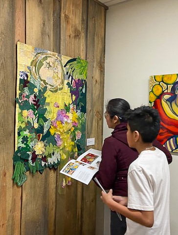 Attendees viewing artwork