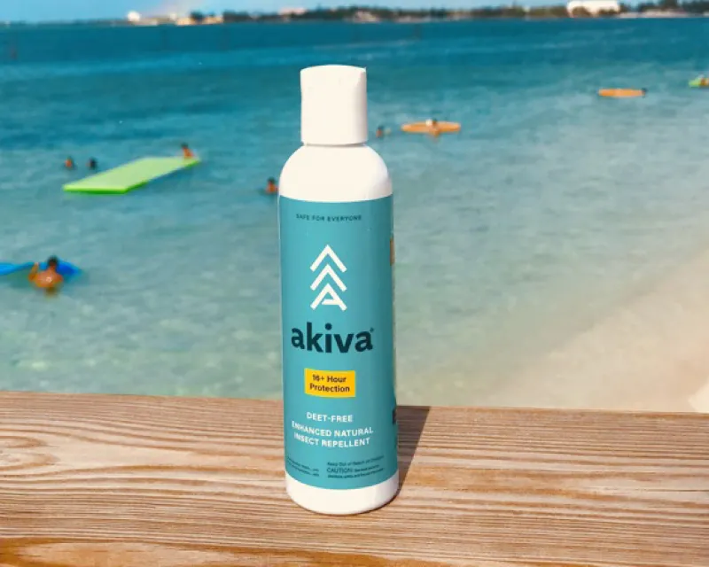 Akiva bottle with a beach in the background