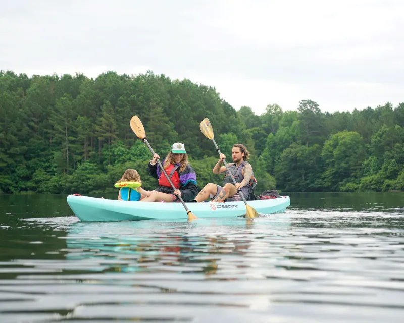 Two people paddling in a Crescent Kayak 