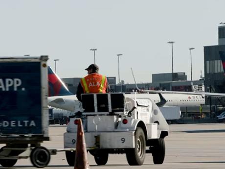 delta workforce luggage-cart-on-tarmac