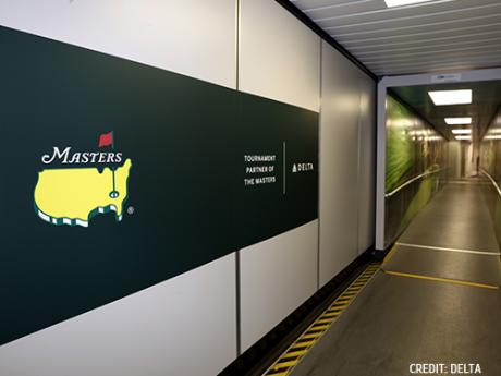 Masters Tournament Logo masters golf logo on wall inside of airport