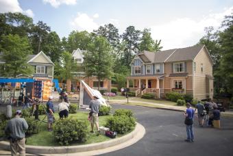 Crew on set outside in a cul-de-sac with three houses in Georgia to promote listing your Georgia property as a potential filming location