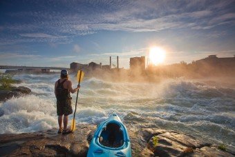 Man looking at Georgia river with his Kayak