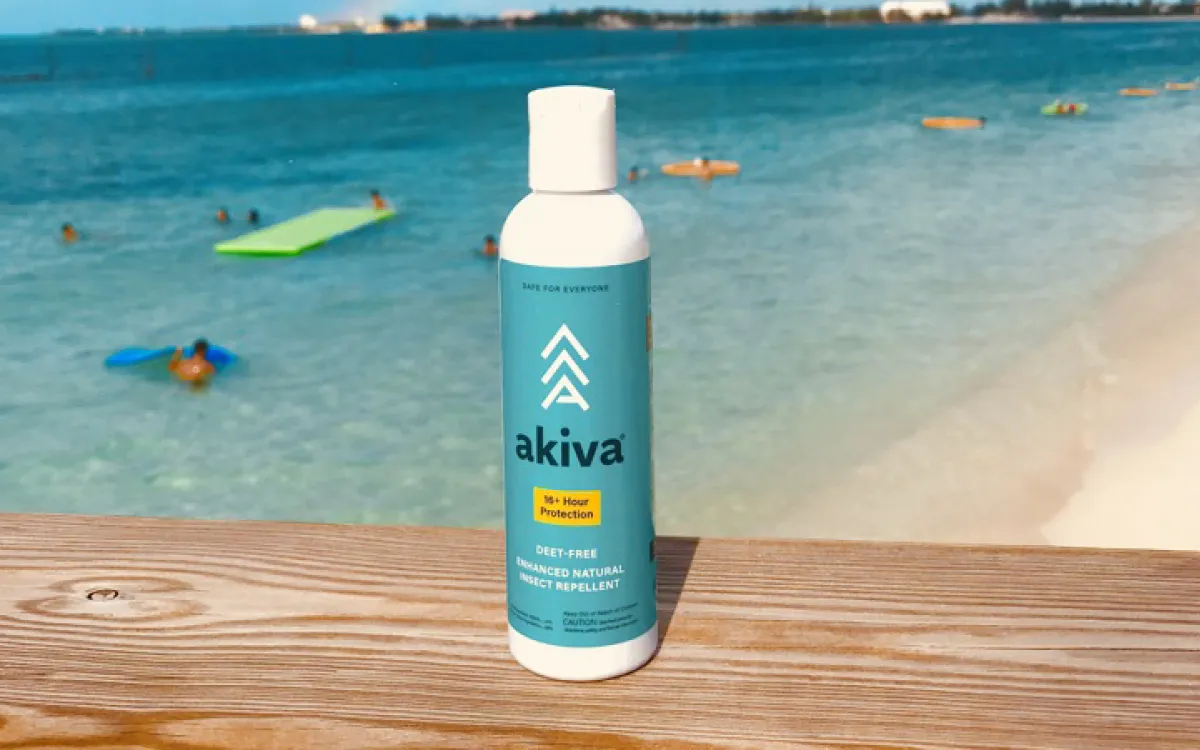 Akiva bottle with a beach in the background