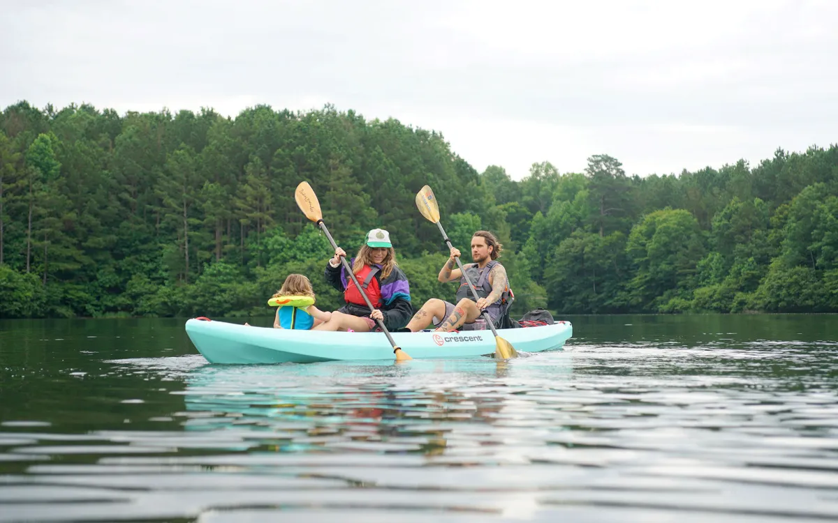 Two people paddling in a Crescent Kayak 