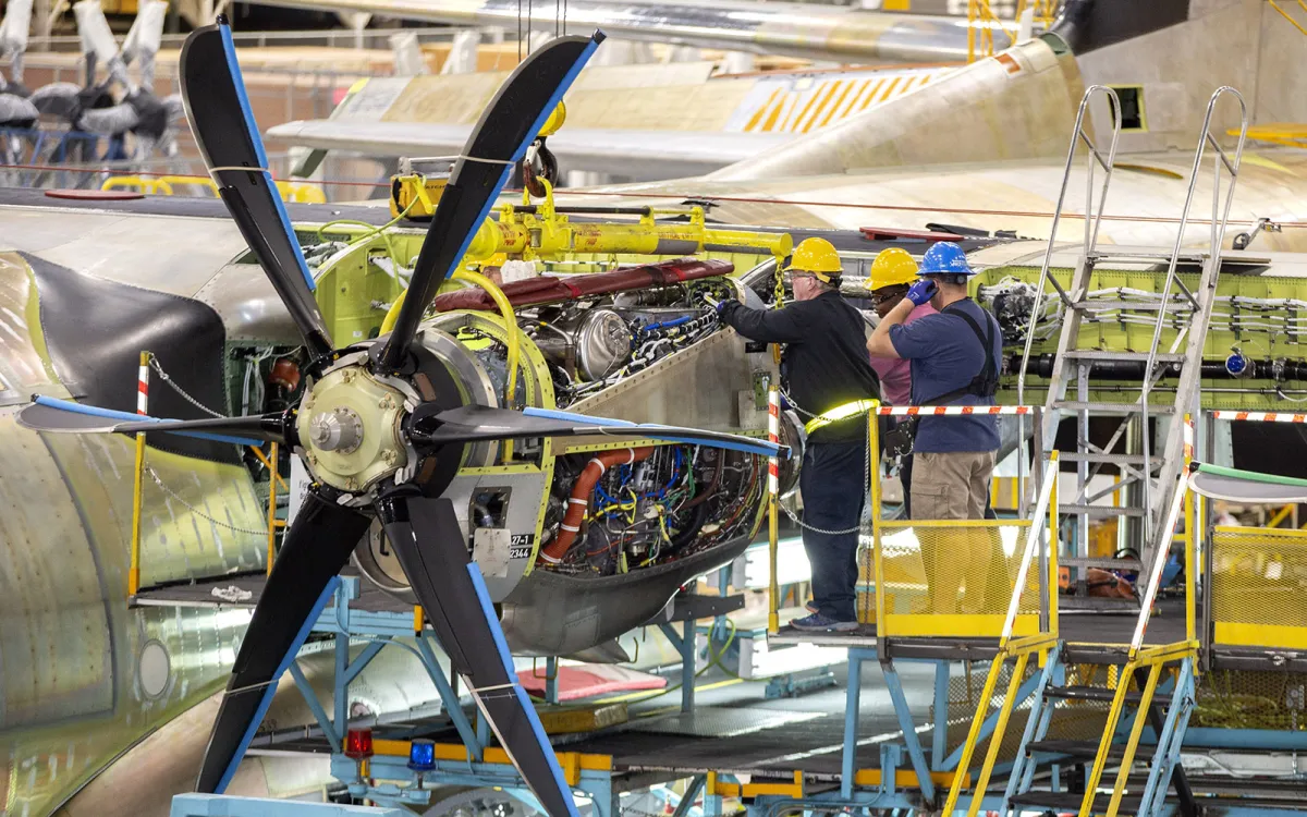 men working on lockheed martin airplane
