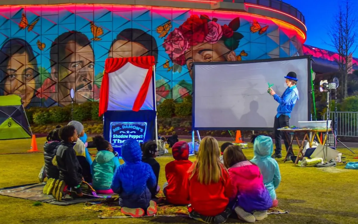 children watching a puppetry performance