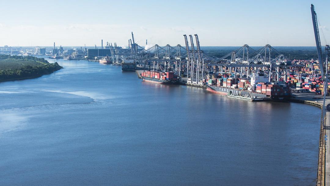 Boats float on bright blue water at the Port of Savannah