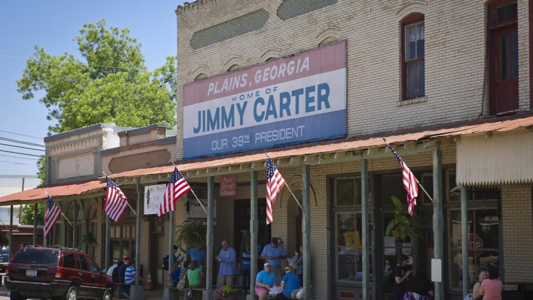 Sumter County Main Street displays a sign that reads "Plains Georgia, Home of Jimmy Carter our 39th President