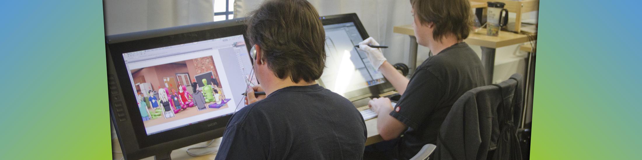 Two students working on large touch screens in Georgia