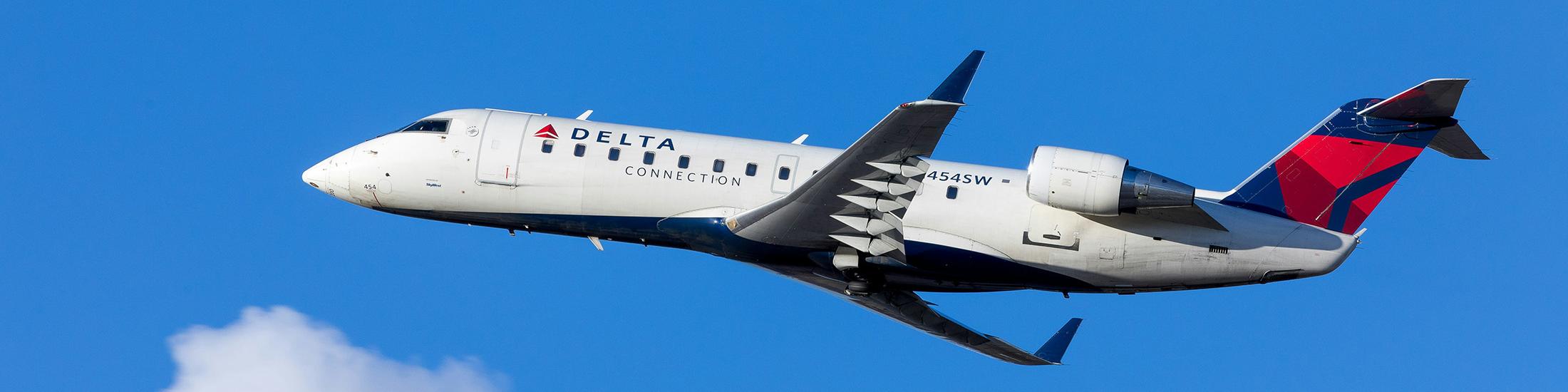 delta-jet-flying-through-sky-with-clouds