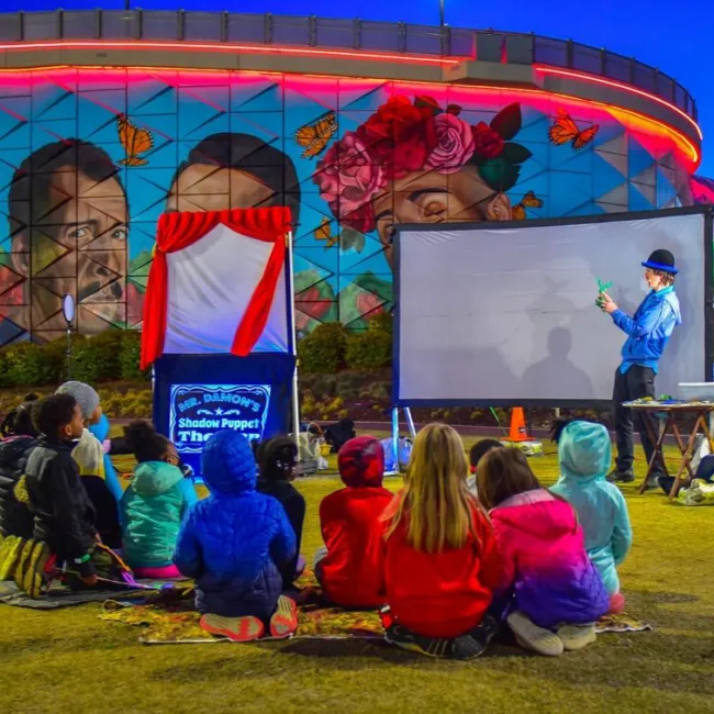 children watching a puppetry performance