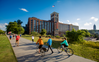 People walking on a paved path at the beltline atlanta