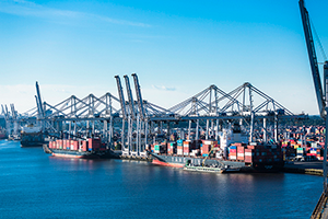 A view of the port of savannah from the water, with several container ships docked