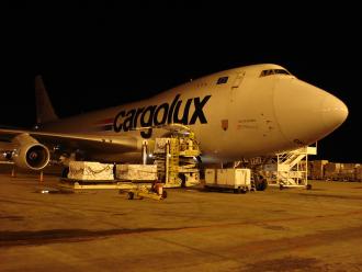 A plane is parked in the dark