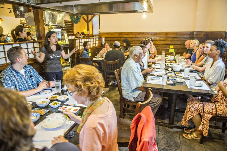 People eating at The Seoul of the South™ food tour