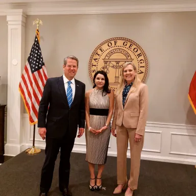 Governor Kemp and First Lady with an international representative for Georgia