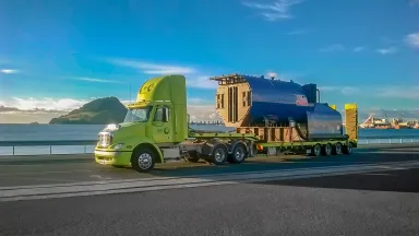 Truck on a highway next to water