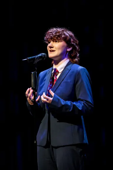 Rory Berg at a microphone