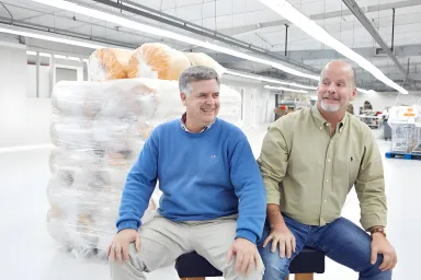 Two business partners sitting next to each other 
