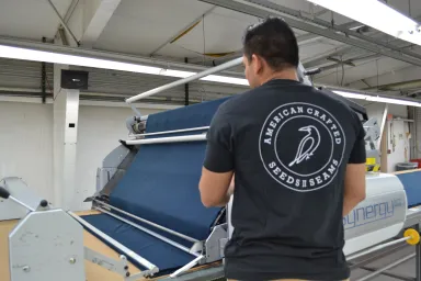 man working at Seeds II Seams