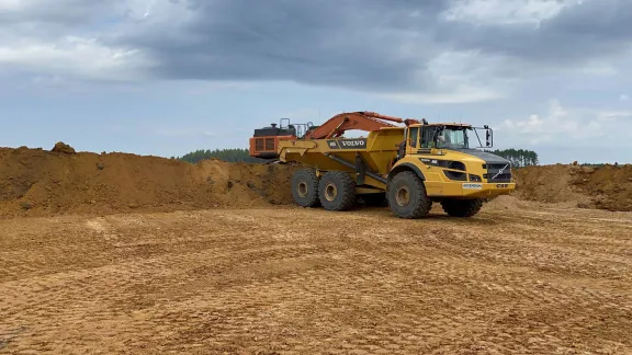 Heavy equipment works on a construction site