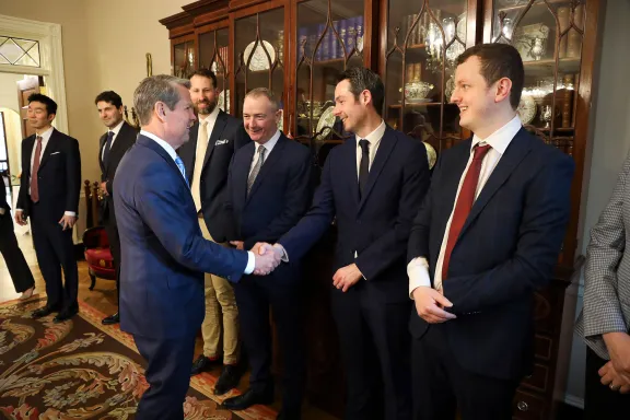 Governor Kemp shaking hands with Georgia's international representatives
