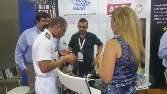 Blue Force Gear employees meeting with customers at a trade show